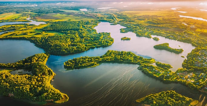 Lyepyel, Lepel Lake, Beloozerny District, Vitebsk Region. Aerial View Of Lyepyel Cityscape Skyline In Autumn Morning. Morning Fog Above Lepel Lake. Top View Of European Nature From High Attitude In Autumn. Bird's Eye View Of Island Pension Lode. Panormic View.