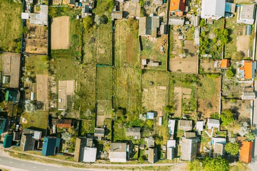 Belarus, Europe. Aerial View Of Small Town, Village Cityscape Skyline In Summer Day. Residential District, Houses And Vegetable Garden Beds In Bird's-eye View.