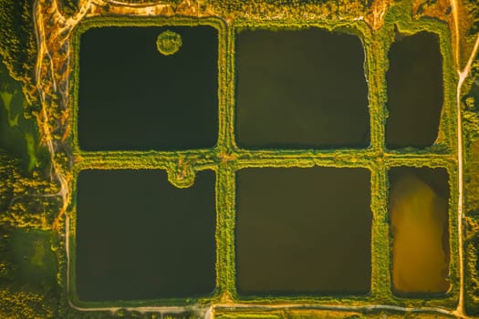Aerial View Retention Basins, Wet Pond, Wet Detention Basin Or Stormwater Management Pond, Is An Artificial Pond With Vegetation Around The Perimeter, And Includes A Permanent Pool Of Water In Its Design.