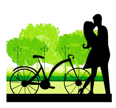 sillhouette of sweet young couple in love standing in the park