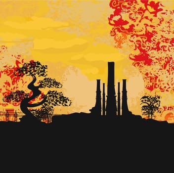 Smoking factory with tree at sunset or sunrise