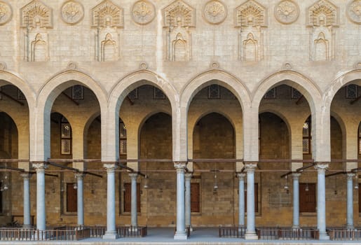 Arched corridor surrounding the courtyard of public ancient mosque of Sultan Al Moaayad, Old Cairo, Egypt