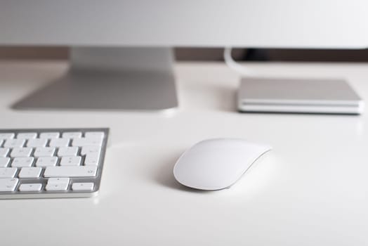 Desktop monitor with a wireless keyboard, mouse and dvd drive