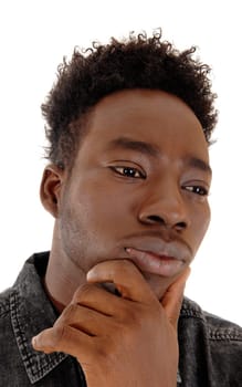 A head shot of the face of a young African American man with his.hand on his chin, isolated for white background..