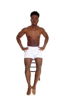 A young African American man sitting in white underwear on a chair,.isolated for white background..