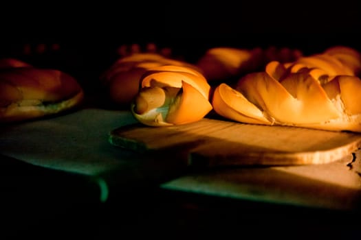 Oven inside plenty of bread. Manufacturing process of spanish bread