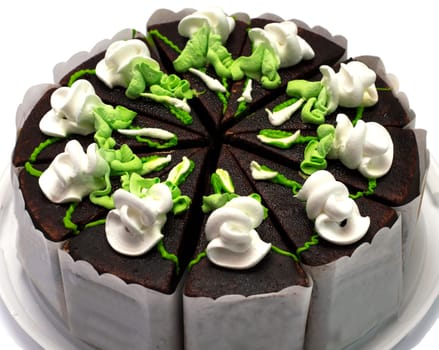 chocolate pie with green and white cream, largely, on a plastic tray