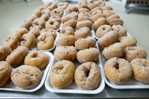 Trays of spanish typical fried donuts or roscas fritas