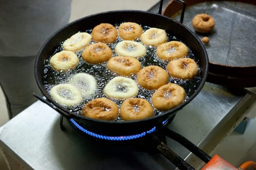 Elaboration process of spanish typical fried donuts or roscas fritas