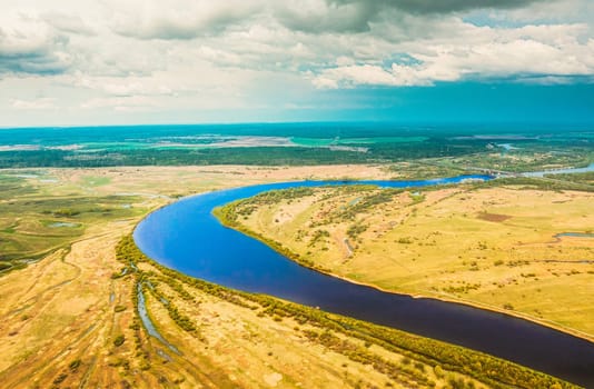 Rechytsa, Gomel Region, Belarus. Aerial View Of Dnieper River. Sky Above Green Meadow And River Landscape. Top View Of European Nature From High Attitude In Summer. Bird's Eye View.
