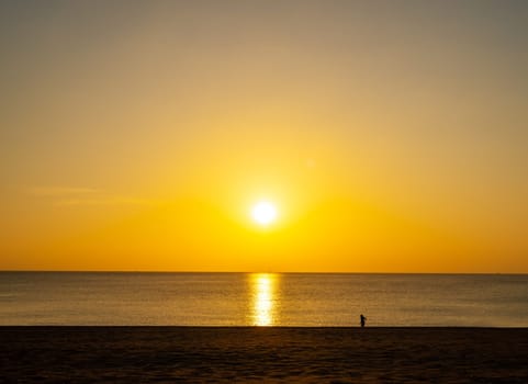Beach sand sunset or sunrise with colorful of cloud sky and sunlight in twilight