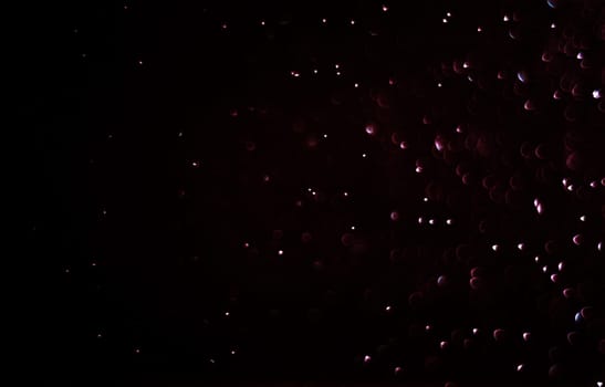 Light abstract dark bokeh christmas circle color glitter blurred black background