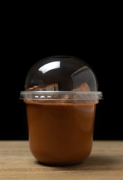 Ice milk tea sweet drink blurred on black background