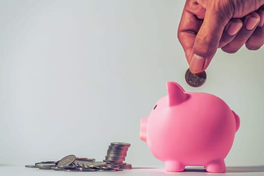 Save money and account banking for finance concept, Piggy bank with coin on blurred background, Save Monney for Investors Using Internet to Trade Stocks or Trade Fund
