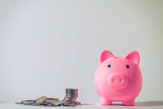 Save money and account banking for finance concept, Piggy bank with coin on blurred background, Save Monney for Investors Using Internet to Trade Stocks or Trade Fund