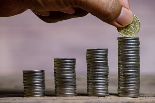 Save money and account banking for finance concept, Hand bank with coin on blurred background, Save Monney for Investors Using Internet to Trade Stocks or Trade Fund