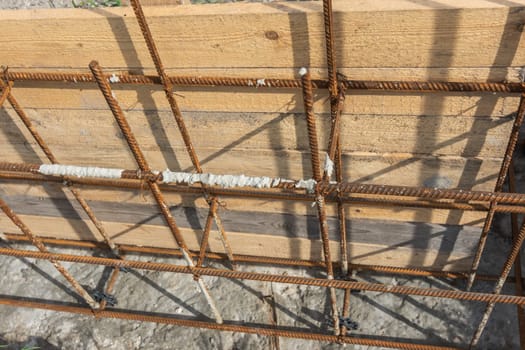 Tied reinforcement and mounted strip foundation formwork close-up