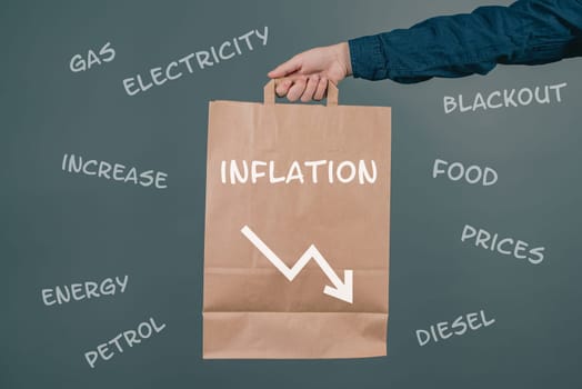 Inflation and financial crash, man holding empty shopping bag, economic development and increasing prices for food and energy