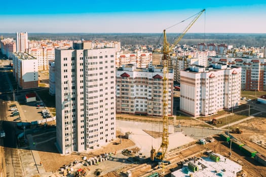 Gomel, Belarus. Construction Crane Is Involved In Construction Of A New Multi-storey Residential Houses. Aerial View Of Multistory Houses. Real Estate High-rise Buildings. Development Industry