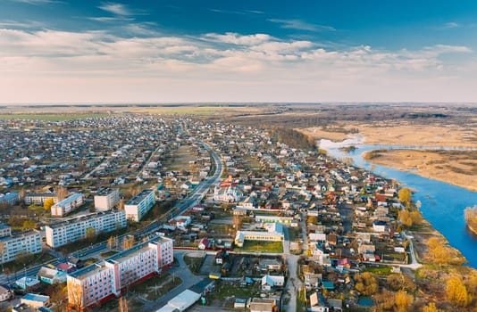 Dobrush, Gomel Region, Belarus. Aerial View Of Dobrush Cityscape Skyline In Spring Evening. Residential District And River In Bird's-eye View.
