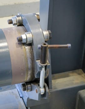 A shaft is temporarily supported in a hinged bearing.
