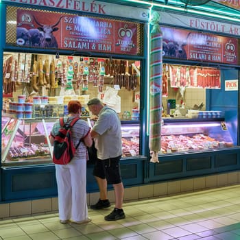 Tourists in the big market hall, Nagy Vásárcsarnok, a popular sight in Budapest