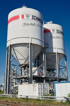 Silos with cement from the German manufacturer Schwenk in the port of Magdeburg