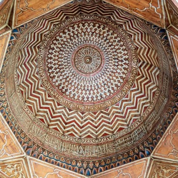 Dome decorated with calligraphy and colorful floral and geometric patterns at Mamluk era public historic Al-Sultan Al-Zahir Barquq Mosque, Moez Street, Old Cairo, Egypt
