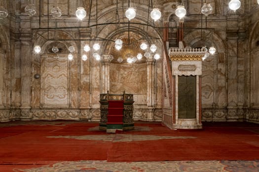 Decorated alabaster - marble - wall with engraved niche - Mihrab - and Platform - Minbar - at the great Mosque of Muhammad Ali Pasha - Alabaster Mosque, situated in the Citadel of Cairo in Egypt