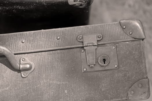 A close-up, detail shot of an old leather suitcase.