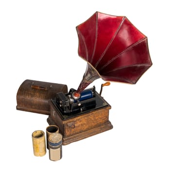 High angle cut out of 1911 old phonograph with three cylinder records, including clipping path, isolated on white
