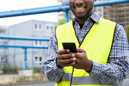 Builder Worker Using Phone. Construction Employee Communication