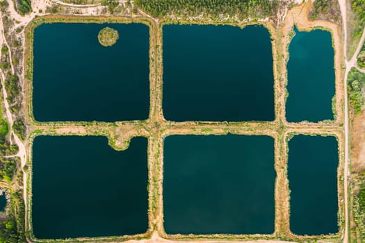 Aerial View Retention Basins, Wet Pond, Wet Detention Basin Or Stormwater Management Pond, Is An Artificial Pond With Vegetation Around The Perimeter, And Includes A Permanent Pool Of Water In Its Design.