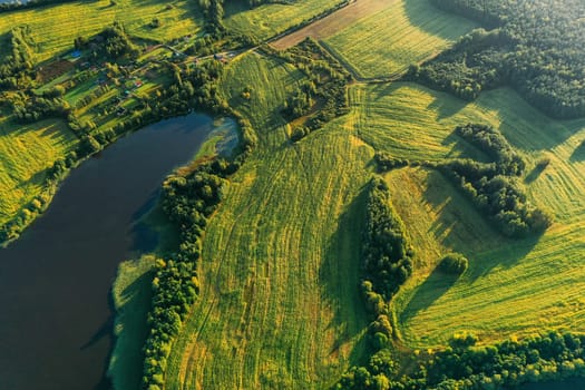 Lyepyel District, Vitebsk Region, Belarus. Aerial View Of Residential Area With Houses In Countryside. Sunny Autumn Morning. Sun Shining Above Town Skyline And Lepel Lake. Flat View.