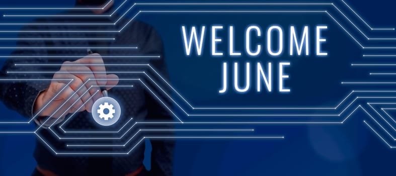 Hand writing sign Welcome June, Internet Concept Calendar Sixth Month Second Quarter Thirty days Greetings Lady in suit holding pen symbolizing successful teamwork accomplishments.