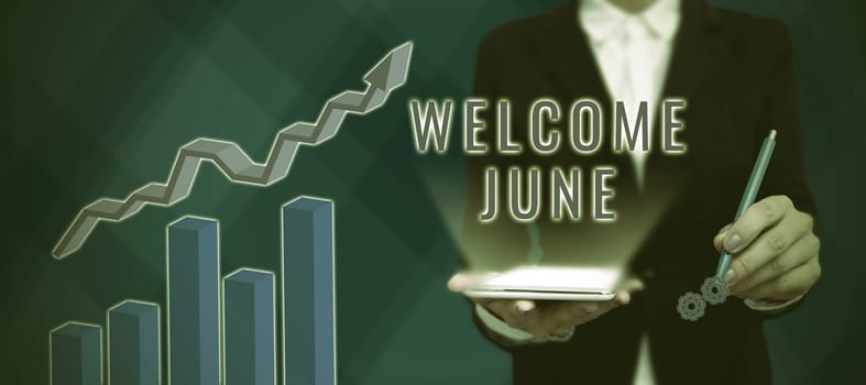 Conceptual display Welcome June, Business concept Calendar Sixth Month Second Quarter Thirty days Greetings Businessman in suit holding open palm symbolizing successful teamwork.