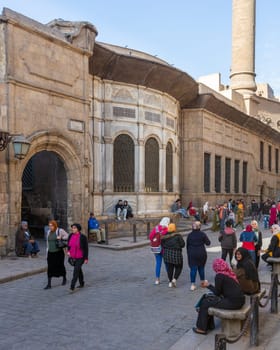 Cairo, Egypt- December 14 2019: Moez Street with facade of Ottoman era historic Soliman Agha El Silahdar complex building, Old Cairo