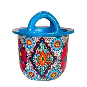 Cut out of handmade artistic pained colorful decorated pottery basket with two handles isolated on white background