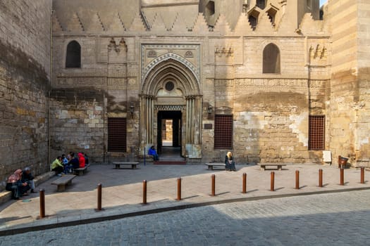Cairo, Egypt- November 11 2016: Entrance of theological school and Mausoleum of Sultan Qalawun, Moez Street