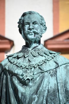 The monument to King Maximilian II of Bavaria stands in front of the Old Palace in Bayreuth on the courtyard. The statue of the Maximilian monument was cast in 1860 and stands on a granite base.
