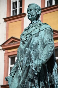 The monument to King Maximilian II of Bavaria stands in front of the Old Palace in Bayreuth on the courtyard. The statue of the Maximilian monument was cast in 1860 and stands on a granite base.