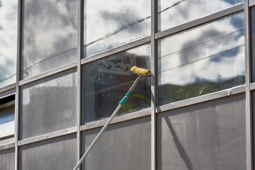 window washing, washing a street shop window. High quality photo