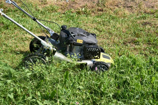 lawn mowing with a lawn mower. High quality photo
