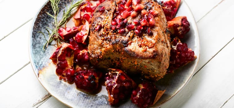 Delicious piece of meat fried with pomegranate.