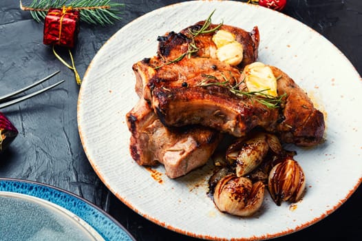 Roasted yummy pork loin for the Christmas table. Meat on baking sheet