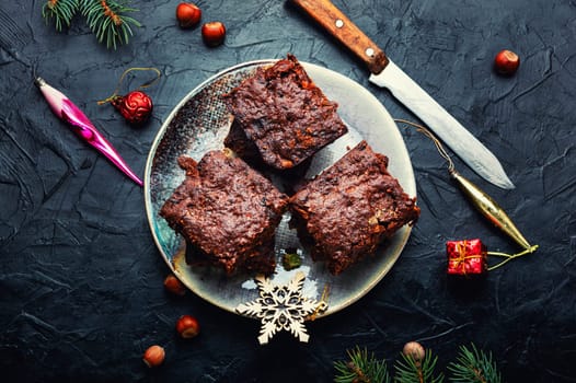Panforte, cake with almonds, nuts, dried fruits and berries. Italian Christmas pastries