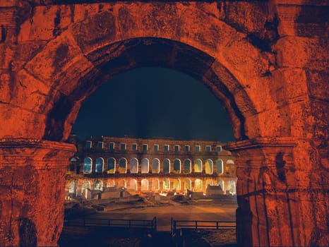 Croatia. Pula. Ruins of the best preserved Roman amphitheatre built in the first century AD during the reign of the Emperor Vespasian shot at night.