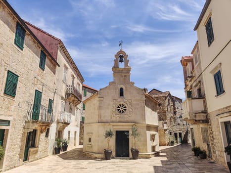 Small church on square of small urban village of Stari grad on Hvar island in Croatia, Adriatic Sea, Europe.