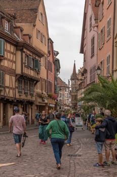 People on a pedestrian street in the historic center of Colmar, Alsace, France