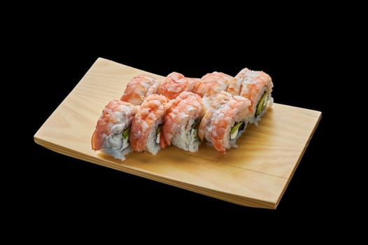 delicious Philadelphia rolls with shrimp on a wooden stand on a black isolated background. High quality photo